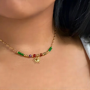 Golden sun pendant necklace with colorful natural stone beads on a 18k gold chain