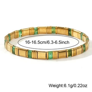Handmade Tila bead stretch bracelet featuring gold-tone cubes and translucent green beads