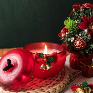 Bougie parfumée en forme de pomme avec nœud rouge et cloche pour déco de Noël