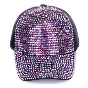 Detail of purple rhinestones on a black baseball cap with vibrant sparkling crystals