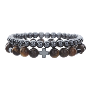 Detail view of hematite beads and tiger eye stones with a central cross charm bracelet
