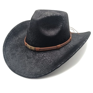 Detail of black faux snakeskin fedora with brown braided rope and bronze emblem decoration