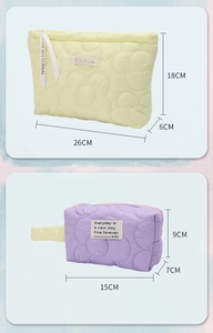 Quilted nylon makeup bags in yellow and purple with floral patterns and size details