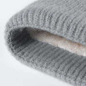 Winter striped knit hat with thick fleece lining and ribbed gray fabric texture