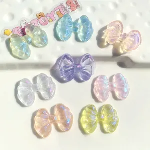 Detail view of 26x19mm colorful glitter resin bowknots for DIY jewelry and hair accessories