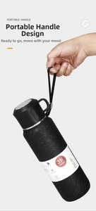 Detail of matte black 316 stainless steel vacuum flask with durable braided handle strap