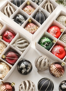 Detailed collection of assorted Christmas balls with glitter and snowflake patterns in box