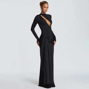 Detail of elegant black slim fit evening dress featuring front cut-out and waist knot