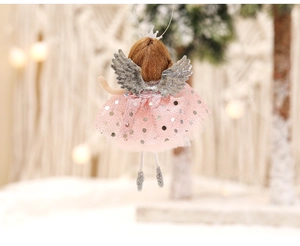 Detail of pink sequin mesh skirt and silver wings on a handmade Christmas angel pendant
