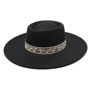 Detail of wide brim wool felt hat with ethnic geometric patterned decorative band
