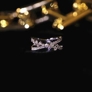 Macro shot of 925 silver double layered crossover ring with sparkling micro pavé crystals