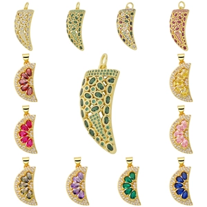 Assorted gold pendants with crescent and horn shapes featuring colorful zircon crystals