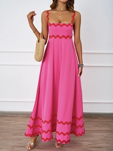 Detailed front view of a pink summer maxi dress with scalloped red trim and thin straps