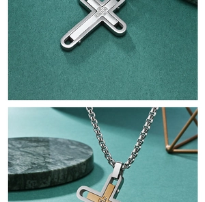 Macro detail of a two-tone cross pendant necklace with rhinestones and gold accents
