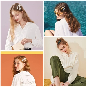 Detailed view of women wearing assorted marble acetate and pearl hair clips in daily life