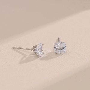 Classic silver titanium steel earrings with round white zircon in four-claw setting