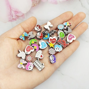 Detail view of assorted colorful cartoon alloy slide charms for 8mm DIY bracelets.
