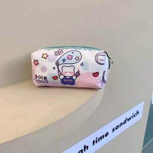 Detail of cute bear canvas pencil case showing colorful prints and teal zipper closure