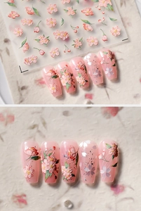 Close-up of 3D embossed cherry blossom nail stickers with floral patterns on nail tips