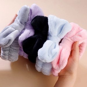 Detailed view of soft coral fleece bow headbands in grey purple black blue and pink