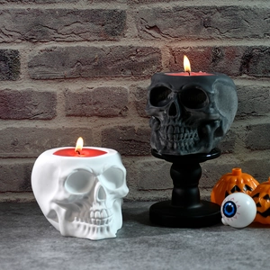 Macro shot of skull candle storage jars in black and white for Halloween decor