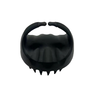 Black silicone scalp massage brush for hair washing with ergonomic handle and soft bristles