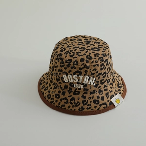 Detailed close-up of leopard print bucket hat with white BOSTON embroidery and side tag