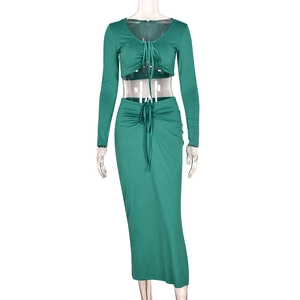 Two-piece dark green long sleeve crop top and maxi skirt set with drawstring details