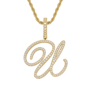 Macro detail of 18K gold letter U pendant with iced out pavé zircon and rope chain