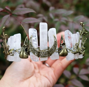 Detail of a handmade crown with clear crystal points and antique bronze crow skulls