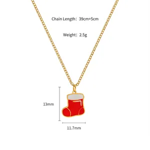 Macro shot of 13mm red Christmas stocking pendant on a golden 39cm adjustable chain