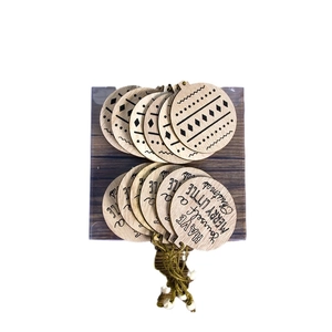 Wooden Christmas snowflake ornaments with geometric patterns and holiday greetings
