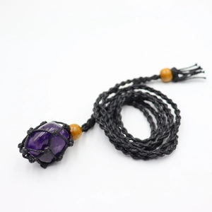Adjustable woven necklace with natural purple amethyst crystal stone in a black cord net