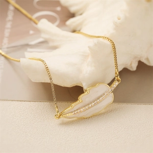 Elegant gold snake chain necklace with white leaf pendant and zircon inlay on shell