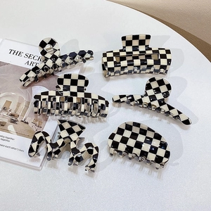 Classic checkered patterns on assorted vintage hair claw clips in various styles