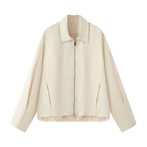 Detailed view of beige cropped jacket with turn-down collar and silver metal zipper