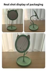 Detail view of light green cat ear desktop makeup mirror with rhinestone inlay and round base