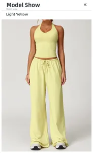 Light yellow yoga set featuring backless halter top and drawstring wide-leg pants