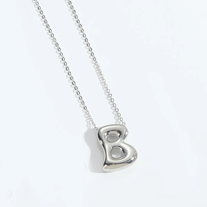 Detailed view of silver letter B puffy necklace with mirror finish on O-chain