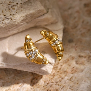 18k gold plated croissant earrings with inlaid white zircons on a natural stone base