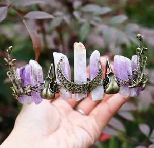 Detailed view of handmade amethyst crystal crown with brass wire and raven skull motif