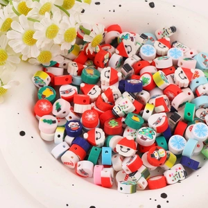 Colorful Christmas polymer clay beads set with Santa and snowman patterns in a white bowl