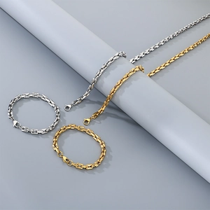 Detail of square pig-nose chain necklaces and bracelets in gold and silver stainless steel