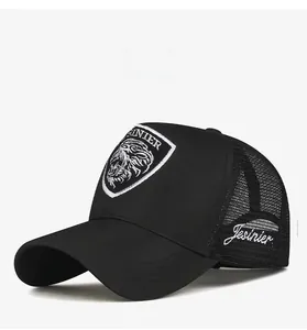 Detail of black trucker hat featuring breathable mesh and lion head embroidery