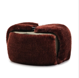 Close-up of winter trapper hat with brown faux fur lining and olive green fabric