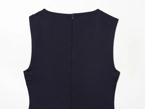 Close-up of black sleeveless dress back with invisible zipper and smooth fabric texture