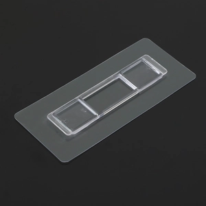 Macro view of clear adhesive shelf patch with dual-slot clip for punch-free wall mounting