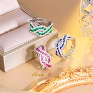 Luxurious crisscross adjustable open rings featuring colorful gems and brilliant diamonds