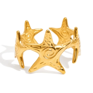 Detailed macro view of 18K gold plated starfish rings with adjustable open band design