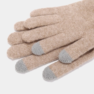 Detailed close-up of knit gloves with camel color body and grey touchscreen fingertips